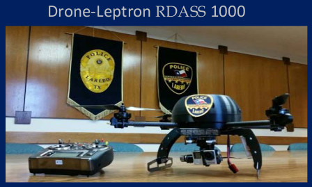 A drone sitting on a desk in front of the Laredo Police Department emblem