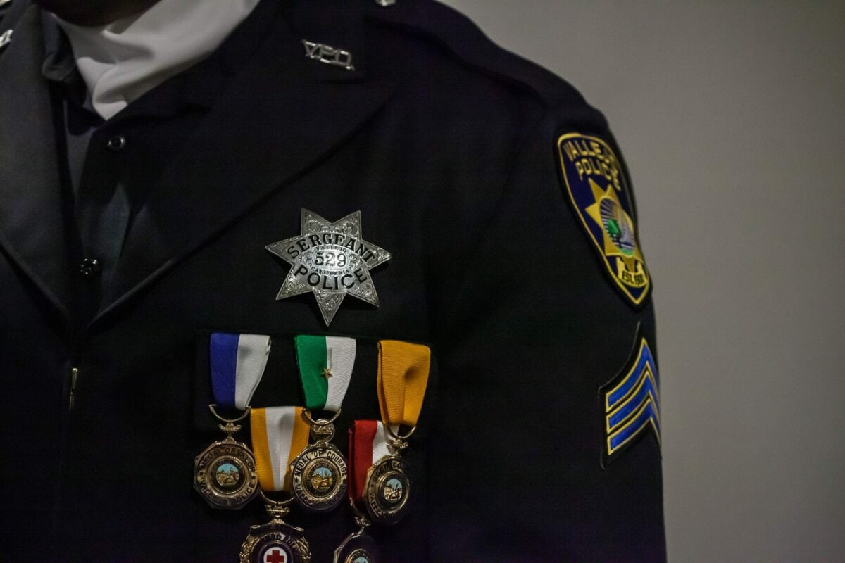 A close-up of a badge and medals on a Vallejo Police Officer's uniform. 