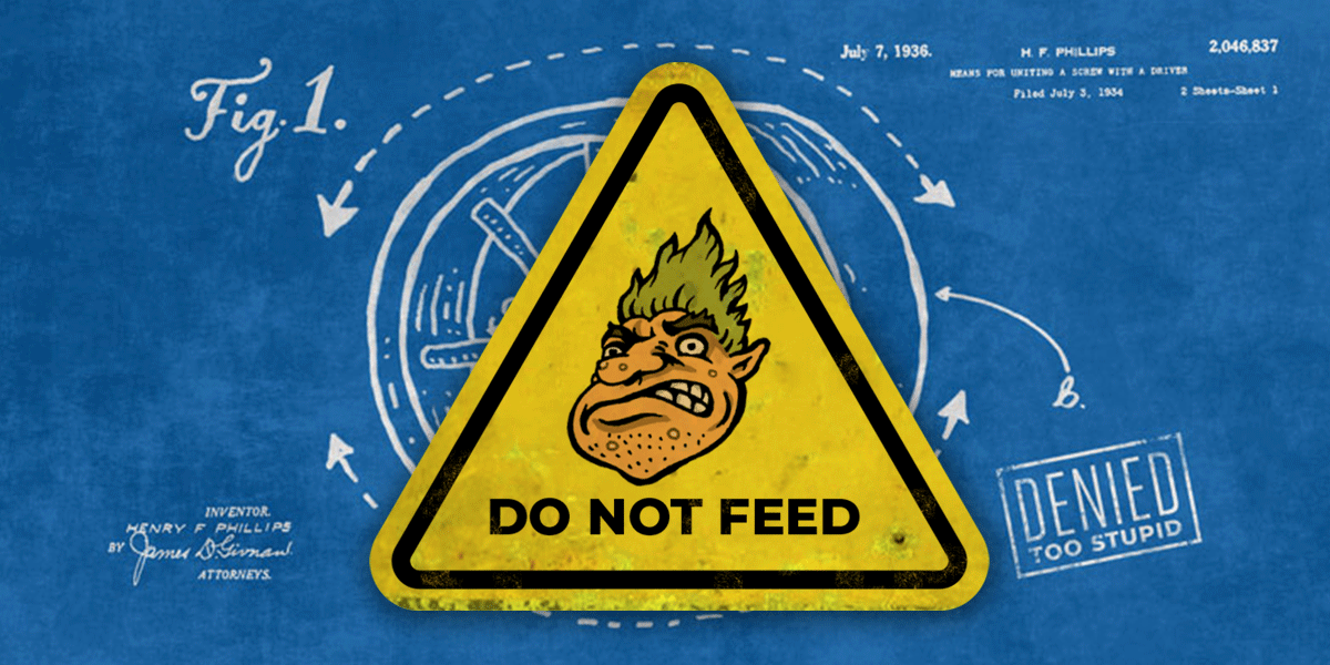 A warning sign with a picture of a troll says "do not feed"