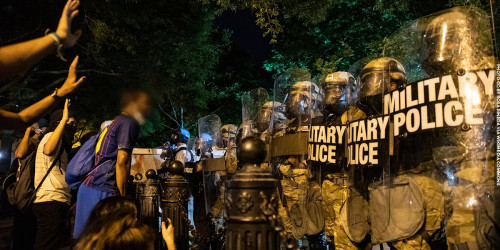 Protesters and police. Photo by Rose Pineda