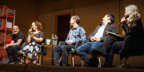 Window Snyder speaking as other panelists listen.